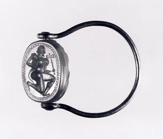 I25 Kneeling man with a double axe and a serpent