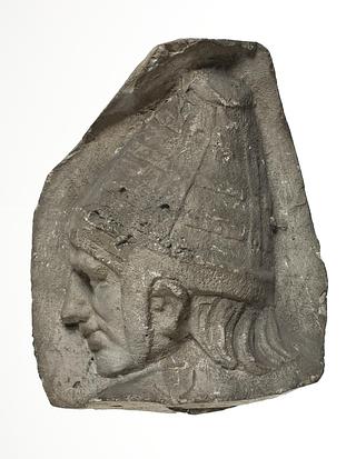 L333h Heads of Sarmatian horsemen wearing conical helmets