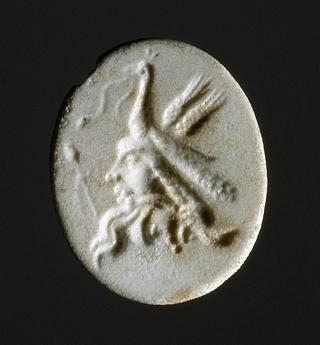 I1549 Combination of two satyr masks and a peacock